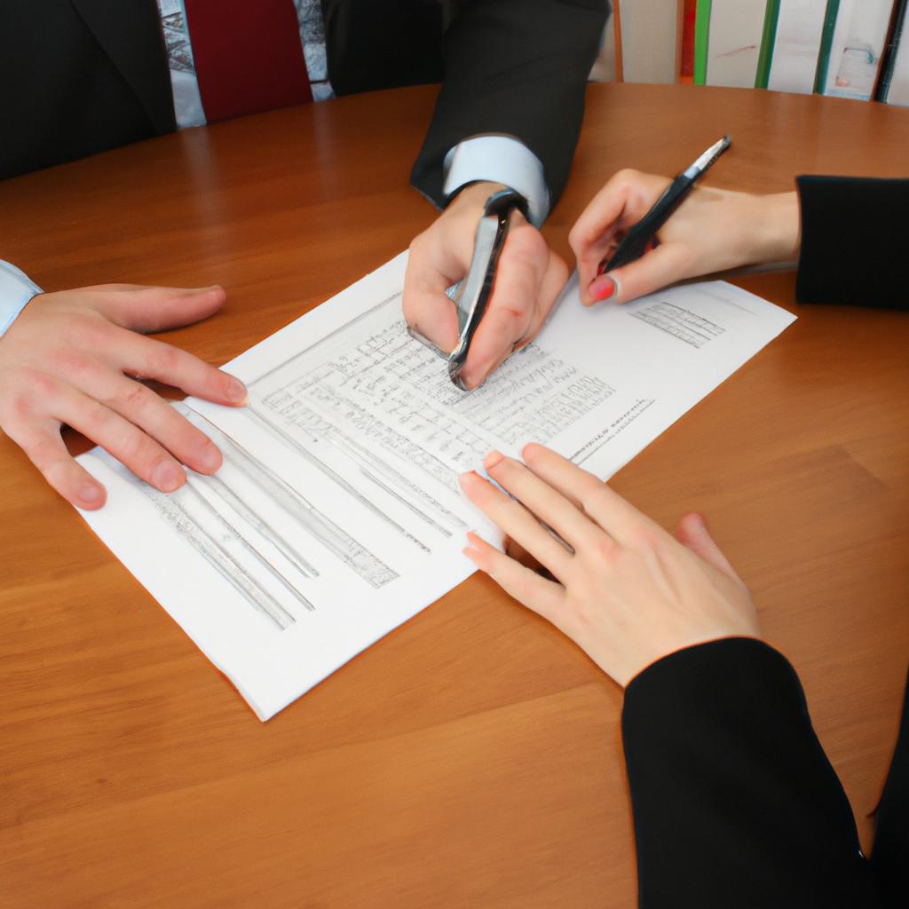Person signing documents with banker